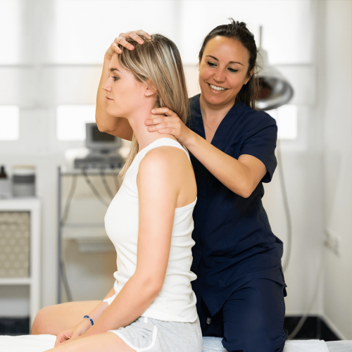 Female Physio Treating Patient